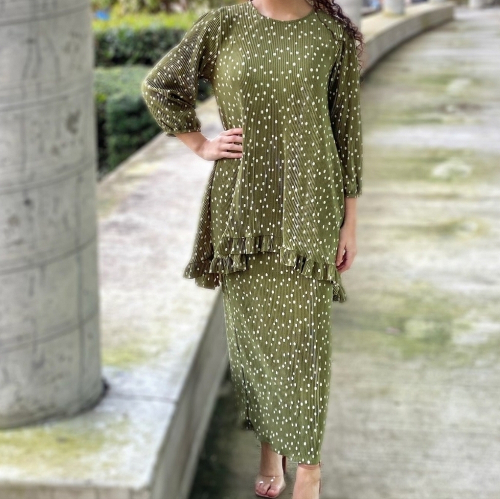 Green and White polka dot outfit.